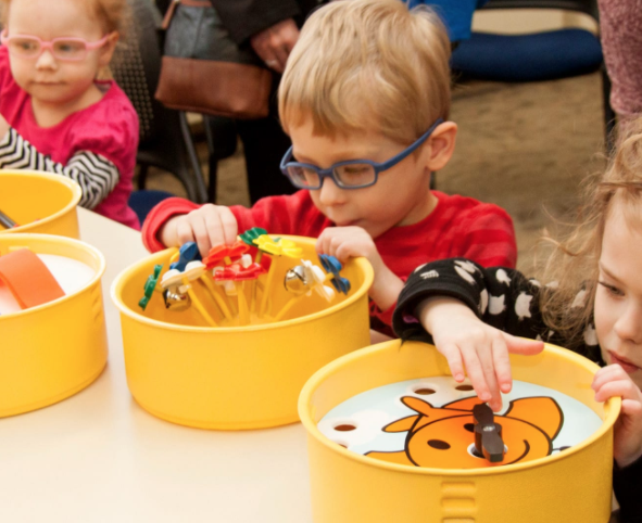 Young child exploring tactile toy