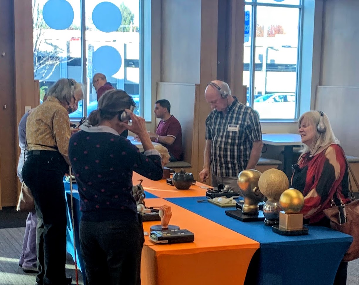 Visitors at the library exploring sculptures.